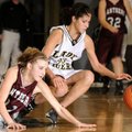 Bentonville Black’s Tayler Estrada, right, and Siloam Springs’ Candice Spry hit the floor for a loos...