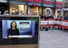 Ann Curry, news anchor of NBC’s Today show, appears Thursday morning on a monitor outside the show’s studio in New York’s Rockefeller Center.