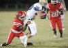 Shiloh Christian junior receiver Jon Hawes, right, is tackled by Farmington sophomore cornerback Dimitri Donovan on Nov. 6 at Allen Holland Field in Farmington. Hawes helped the Saints overcome a 35-point deficit last week in a 51-49 win over Nashville