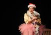 Joetta, played by Janelle Lipscomb, clutches the baby Jesus while composing a letter to Santa, baby Jesus, Bing Crosby and the Easter bunny during rehearsal for “A Dupont White Trash Christmas” at Fayetteville High School.
