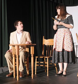 Joseph (Josh Cohorst) shares a moment with Lauren Bacall and Humphrey Bogart during the NorthWest Arkansas Community College production of “Hotel Cassiopeia.” The drama is on stage in White Auditorium this weekend and next. 
Joseph orders from a waitress (Caitlin Howle) in “Hotel Cassiopeia.”