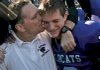 El Dorado Coach Scott Reed celebrates the Wildcats’ 27-20 victory over Pine Bluff in the Class 6A championship game with his son and quarterback, Taylor, after Saturday’s game at War Memorial Stadium in Little Rock. The victory gave the Wildcats their second state championship and first since 1958. 