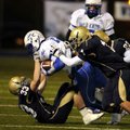 Shiloh Christian linebackers Colt Thomas, bottom, Mitchell Roberts, center, and Chase Richards tackl...