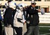 Springdale Har-Ber coach Chris Wood talks with his players during a walk through Friday at the team’s practice field in Springdale. The Wildcats will face Fort Smith Southside today in the 7A state football championship at War Memorial Stadium in Little Rock.