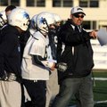 Springdale Har-Ber coach Chris Wood talks with his players during a walk through Friday at the team’...