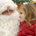 Alivia Peris, 3, makes a face Saturday and refuses to smile at Santa Claus until the conversation tu...