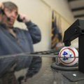 Kim Emerson, with the American Legion post in Bentonville, practices calling bingo Friday while sett...