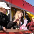 Cade Lastovica, 10, from left, Madison McGuire, 8, Jack Short, 10, and Bryant Parlin, 8, wave Saturd...