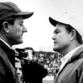 Arkansas football coach Frank Broyles, left, and Texas coach Darrell Royal greet on the field in Fay...