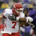 East Carolina's Scotty Robinson (53) tackles Houston's quarterback Case Keenum (7) during the first ...