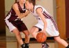 Siloam Springs guard Shelbi Honeycutt, right, drives past Gentry’s Courtney Folker during the Benton County Invitational girls championship Saturday in Siloam Springs.