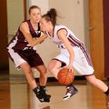 Siloam Springs guard Shelbi Honeycutt, right, drives past Gentry’s Courtney Folker during the Benton...