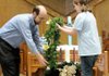 Tony Matthews and his daughter, Katie, 11, place the wreath around the Advent candles in a Hanging of the Greens ceremony on Nov. 29 at the First Christian Church in Bentonville.