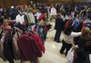 Area residents pick out winter coats Saturday at Southside Church of Christ in Rogers. The church gave away 3,000 coats during its fifth annual event.