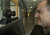 Microsoft Corp. researcher Eric Horvitz looks at a camera that is part of a nonfunctioning computerized receptionist outside his office in Redmond, Wash.