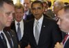 President Barack Obama exits the Senate Democratic caucus Sunday on Capitol Hill with Sen. Max Baucus after encouraging Democrats in their battle over health-care legislation.