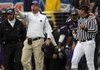 East Carolina Coach Skip Holtz, second from left, yells at an official Saturday during the second half of the Conference USA championship game against Houston in Greenville, N.C. East Carolina won 38-32.