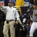 East Carolina Coach Skip Holtz, second from left, yells at an official Saturday during the second ha...