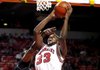 Arkansas freshman Marshawn Powell is fouled while going to basket by Delaware State sophomore James Marcellus during the first half of the Razorbacks' 71-53 win Monday at Bud Walton Arena in Fayetteville.