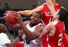 UALR’s Montrell Thornton (center) battles for a rebound with Lyon College’s Slater Belew (top right) and Andy Lee during Sunday’s game at the Jack Stephens Center in Little Rock.