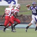 Fayetteville quarterback Brandon Allen looks for an open receiver Sept. 11 as Jefferson City’s Davon...
