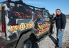 Steve Holden, owner of Northwest Arkansas Sign Shop in Fayetteville, shows off the Hummer wrapped in camouflage and ads for his business.