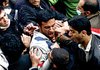 Anti-government students and hard-line students scuffle Monday during demonstrations at the Tehran University campus in Tehran, Iran.