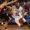 George’s Dorantez Evans drives past Heritage ninth grader Luke Fryauf Monday.