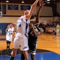 Woodland Junior High’s Vanessa Matlock, left, and Bentonville Gold post Jamayne Potts reach for a ba...