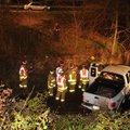 ayetteville firefighters work at the scene Monday after a Ford pickup went into a ditch along South ...