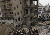 Fire fighters and rescuers search for survivors at the site of a bomb attack near the new Finance Ministry in Baghdad, Iraq, Tuesday.