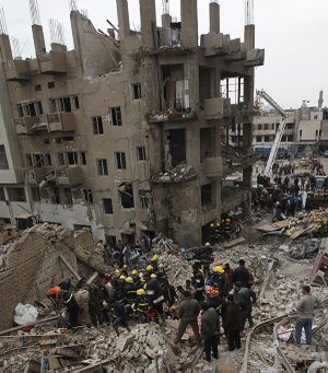 Fire fighters and rescuers search for survivors at the site of a bomb attack near the new Finance Ministry in Baghdad, Iraq, Tuesday.