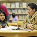 Simona Puente, right, helps her daughter, Lizbeth, 7, study math Monday at the Springdale Library. L...