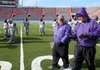 Junction City defensive coordinator Brad Smith , left, talks with head coach David Carpenter, right, during practice Wednesday afternoon