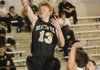 Bentonville’s Jonathan Koonce makes a layup Tuesday against Elkins.

