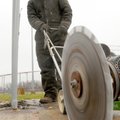 Virgil Isaac of Matrix Construction saws through a concrete slab in Memorial Park in Bentonville on ...
