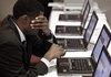 Terrell Collins of Detroit searches job postings at a job fair in Livonia, Mich., on Nov. 4.