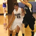 Elkins’ Mackenzie Leichner drives down court as Bentonville’s Tyler Haggard defends Tuesday
