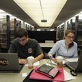 Corey Bull, left, and Kimberly Pierson study Tuesday in Mullins Library at the University of Arkansa...