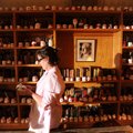 Sarah Leflar sorts through her collection of Santa Claus mugs on Monday at her Fayetteville home.