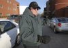 Marvin Berggren, a security officer at Bentonville High School, directs traffic Wednesday at the school. Despite recent warnings from school administrators, Berggren and other school safety officials see few speeding problems on campus.