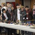 Area high school students watch a drag race with cars powered by compressed air Wednesday during a t...