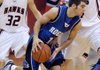 Rogers High guard Wyatt Hively, center, tries to drive around Pea Ridge’s Kip Kelly on Nov. 21. Rogers and Pea Ridge are among the field of teams competing in the Arvest Hoopfest Classic starting today in King Arena at Rogers High.