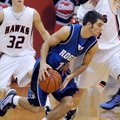 Rogers High guard Wyatt Hively, center, tries to drive around Pea Ridge’s Kip Kelly on Nov. 21. Roge...