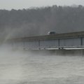 Fog from Beaver Lake rolls across the Arkansas 12 bridge on a frigid Wednesday morning. Cold air ove...