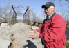 James Fulfer, bridge superintendent for Benton County, talks Wednesday about some of the problems with the bridge over the Illinois River on Fisher Ford Road.