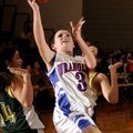 Springdale George’s Kelly Baxter shoots after splitting two Alma defenders during the first half of ...