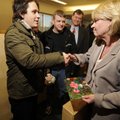 Shane Murphy, left, congratulates Judge Mary Ann Gunn on Thursday after Gunn received FBI Director’s...