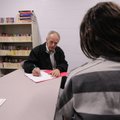 Dr. Willard Howard consults with a patient at the Washington County Jail on Monday.
