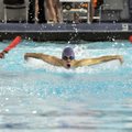 Fayetteville’s Jacob Compton swims the 100-yard butterfly Thursday at the Springdale Har-Ber Invitat...